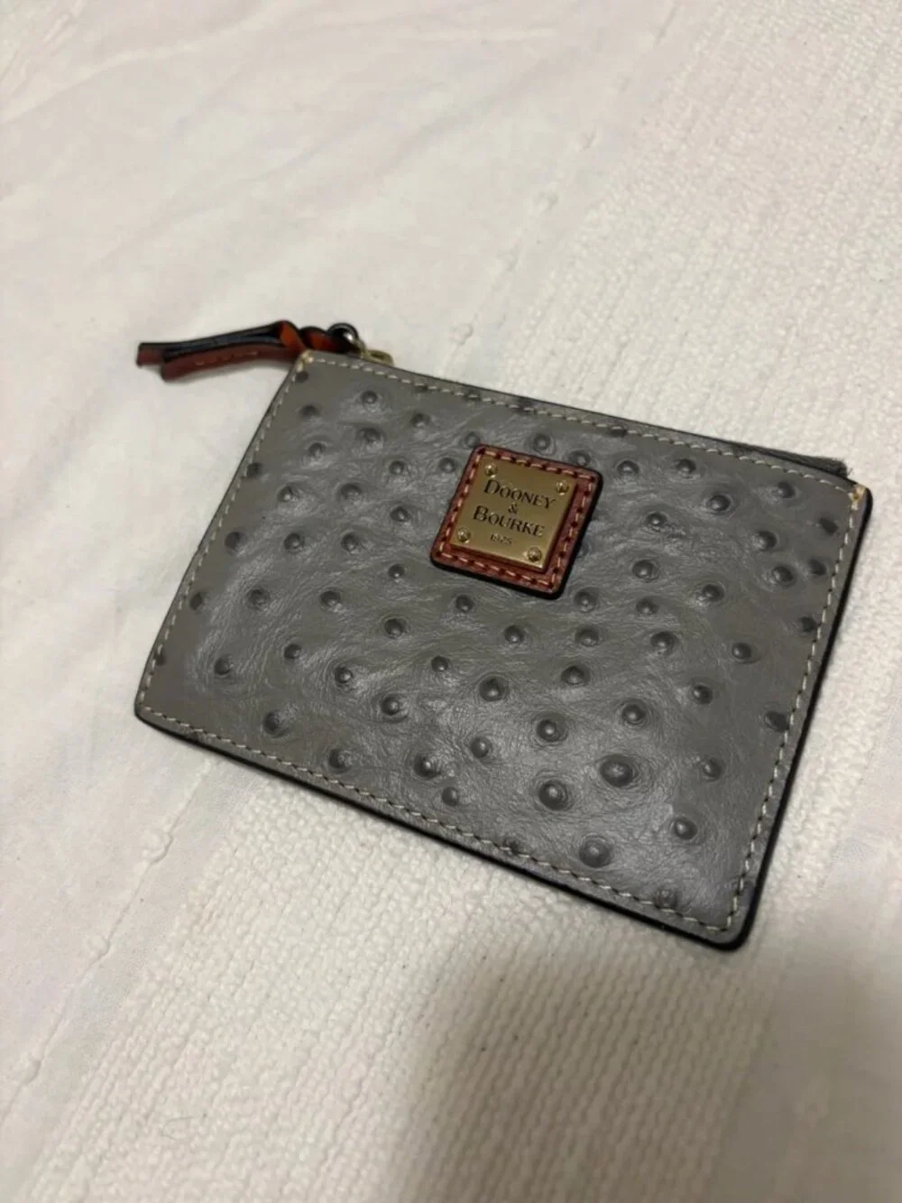 Dooney & Bourke Grey Ostrich-Embossed Zip Card Case with Gold Plaque